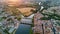 Aerial top view of Beziers town, river and bridges from above, France