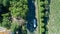 Aerial top view of boat in Canal du Midi from above, family travel by barge and vacation in France