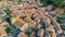 Aerial top view of Bram medieval village architecture and roofs from above, France