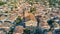 Aerial top view of Bram medieval village architecture and roofs from above, France