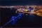 Aerial top view city Krasnoyarsk bridge through Yenisei river evening with neon light