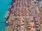 Aerial top view of container cargo ship in the export and import business and logistics international goods in urban city.