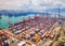 Aerial top view of container cargo ship in the export and import business and logistics international goods in urban city.