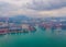 Aerial top view of container cargo ship in the export and import business and logistics international goods in urban city.