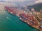 Aerial top view of container cargo ship in the export and import business and logistics international goods in urban city.