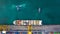 Aerial top view container ship at terminal seaport with tugboat, Global business cargo freight ship import export logistic and