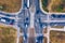 Aerial top view of crossroads with lot of vehicles or car traffic, modern urban intersections and junctions in midtown. Road