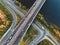 Aerial or top view from drone to road junction, freeway and bridge and car traffic in big city, urban transportation concept