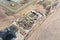 Aerial top view of the foundation of buildings under construction multistoried living space and construction cranes