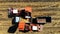 Aerial top view. harvesting corn. combine harvester machines Pouring Fresh corncobs to a truck with trailers after