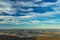 Aerial top view highland hills valley horizon line background landscape scenic view dramatic vivid blue sky cloudscape copy space