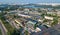 Aerial top view of industrial park zone from above, factory chimneys and warehouses, industry district