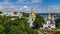 Aerial top view of Kiev Pechersk Lavra churches on hills from above, cityscape of Kyiv, Ukraine