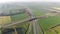 Aerial Top view of the motorway. Interchange between the motorway and the city. The exit of the motorway the view from