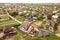 Aerial top view of new modern residential house cottage with blue shiny solar photo voltaic panels system on roof. Renewable