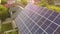 Aerial top view of new modern residential house cottage with blue shiny solar photo voltaic panels system on roof. Renewable ecolo