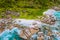 Aerial top view of ocean waves hitting granite rocks on the Anse Marron beach, La Digue, Seychelles