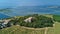 Aerial top view of old church on island from above, canal du Rhone a Sete, Camargue, France