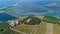 Aerial top view of old church on island from above, canal du Rhone a Sete, Camargue, France