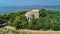 Aerial top view of old church on island from above, canal du Rhone a Sete, Camargue, France