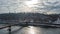 Aerial top view of pedestrian Park bridge in winter and Dnieper river from above, snow Kyiv cityscape, city of Kiev skyline