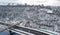 Aerial top view of pedestrian Park bridge in winter and Dnieper river from above, snow Kyiv cityscape, city of Kiev skyline