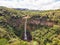 Aerial top view perspective of Chamarel Waterfall in the tropical island jungle of Mauritius.