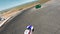 Aerial top view professional driver drifting car on asphalt road track,