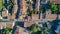 Aerial top view of residential area houses roofs and streets from above, old medieval town background in France