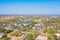 Aerial top view of residential local houses, nature trees, Nonthaburi City, Thailand in urban city town in Asia, buildings