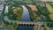 Aerial top view of river, canal du Midi and bridges from above, Beziers town in South France