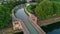 Aerial top view of river, canal du Midi and bridges from above, Beziers town in South France