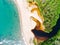 Aerial top view of river merging to tropical white sand beach and turquoise clear sea water