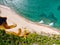 Aerial top view of river merging to tropical white sand beach and turquoise clear sea water