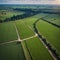 an aerial top view of a rural road.