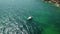 Aerial Top View of a sailboat in blue water