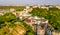 Aerial top view of Saint Andrew`s church and Andreevska street from above, cityscape of Podol district on sunset, skyline of Kyiv