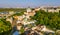 Aerial top view of Saint Andrew`s church and Andreevska street from above, cityscape of Podol district on sunset, skyline of Kyiv