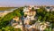 Aerial top view of Saint Andrew`s church and Andreevska street from above, cityscape of Podol district on sunset, skyline of Kyiv