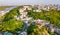 Aerial top view of Saint Andrew`s church and Andreevska street from above, cityscape of Podol district on sunset, skyline of Kyiv