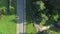 Aerial Top view Shot of group of athletes on a summer green lawn does a warm-up and performs sports exercises.