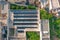 Aerial top view solar panels on the roof of the building, an alternative source of energy production, in a city with dense