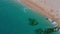 Aerial Top View Of Stones In Turquoise Sea Water Waves Wash The Rocks, Sandy Coast