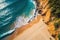 Aerial top view of stunning golden sand beach with turquoise water