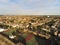 Aerial top view  at tennis courts and private houses in Whitstable, Kent, Uk, England. Evening sunset light on the properties in W
