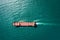 Aerial top view Tugboat drag Oil ship tanker on green sea going to shipyard repair