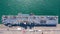 Aerial top view USA aircraft carrier warship transportation fighter plane, helicopter, tank, battleship