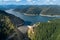 Aerial top view on Vidraru dam, reservoir lake and Fararas mountains, Romania