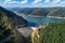 Aerial top view on Vidraru dam, reservoir lake and Fararas mountains, Romania