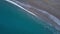 Aerial top view waves break on beach drone rotation above blue ocean waves